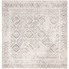 a white and grey rug with an intricate design on the bottom, in front of a white background