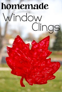 a glass window with the words homemade window clings on it and a red maple leaf