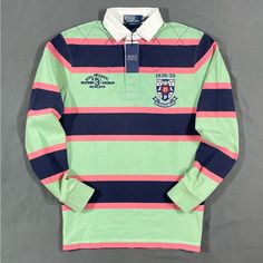 Polo Ralph Lauren Striped Rugby Shirt Details - Brand New With Tags - Sizes : Medium, Large Available. Xl Sold Out - Colors : Green / Navy Blue / Salmon - Collegiate Logo Patch Top Left Chest - “Rl 3 Eastern Division” Embroidered Top Left Chest - 100% Cotton - Fit : Classic - Quarter Top Quilt Stitching Shipping - Item Will Be Shipped The Same Day Of Purchase Or The Very Next Business Day. Tracking Included. Fully Insured Blue Long Sleeve Shirt With Striped Collar, Long Sleeve Blue Shirt For College, Blue Long Sleeve Shirt For College, Striped Long Sleeve Tops For College, Classic Multicolor Long Sleeve Tops, Preppy Green Cotton Top, Green Preppy Cotton Tops, Green Long Sleeve Shirt With Striped Collar, Preppy Blue Polo Collar Top