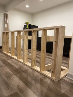 an unfinished room with hard wood floors and white walls