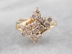 These diamonds have excellent color, and arranged together this way they form a sweet scrolling cluster in one sparkling gold group in the center of this ring! Metal: 14K Yellow Gold Gem: 16 Diamonds totaling 1.12 Carats, H in Color, SI1 in ClarityGem Measurements: 2.5 mm, Round Ring Size: 6.50Marks: “IGP 14KT” Stamped on the inside band Cluster Diamond Ring For Anniversary, Cluster Diamond Wedding Ring, Pink Diamonds Engagement, Pink Diamond Engagement Ring, Ladies Rings, Right Hand Ring, Vintage Cocktail Ring, Star Of David Pendant, Yellow Gold Diamond Ring