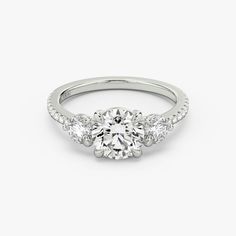 a diamond engagement ring with three stones on the side