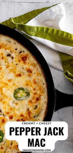 a cheesy pepper jack macaroni and cheese casserole in a cast iron skillet