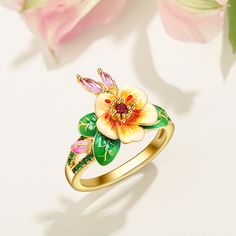 Pear blossoms traditionally represent purity, love, and longevity in Chinese culture and are also considered one of the most beautiful flowers when they are kissed with raindrops, sometimes used to describe attractive women, further promoting the flower's feminine nature. The ring features pear blossoms and leaves that wrap around your finger, detailed with bright enamel for lovers of colour! The perfect accessory for spring and summertime, or to keep the floral vibe going all year round.Carat W Spring Wedding Flower Ring, Spring Flower Jewelry For Anniversary, Flower-shaped Wedding Rings For Spring, Flower Shaped Wedding Rings For Spring, Spring Wedding Rings With Flower Shape, Spring Wedding Rings In Flower Shape, Elegant Spring Flower Ring Gift, Feminine Nature, The Most Beautiful Flowers