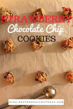 chocolate chip cookies are arranged on parchment paper with a spoon next to them and the words strawberries chocolate chip cookies