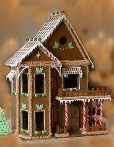 a gingerbread house is decorated with candy canes