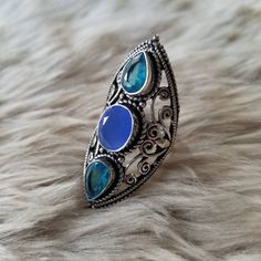 "Many have inquired about the rings I wear in this fashion, so here you go! Witchy ring in silver setting in an elongated style that measures approximately 1.75\". Let me know if you have any questions. Thanks for looking! Blessed be. *Note: While I love the style of these rings, I did not make them and therefore, cannot claim to call many of the stones anything other than pretty, faceted, glass set in silver settings. There are exceptions! Those exceptions will be noted within the listing itsel Witchy Rings, Witchy Ring, Goddess Ring, Blessed Be, Faceted Glass, The Rings, Glass Set, Jewelry Box, Gemstone Rings