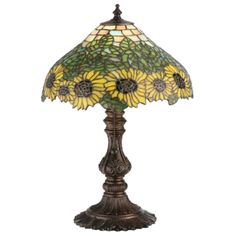 a lamp that has sunflowers on it