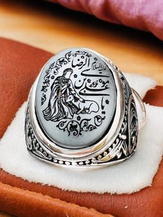 Natural Hematite Islamic Carving Natural Genuine Hadid Imam Riza,Ali bin Musa el-Rıza, Imam & Deer, 925 silver Ring Stone size is 15x20mm Back of ring is open to touch the stone Islamic Scraping,Islamic Men's Ring,Islamic Carving,Islamic Gift for Men,Islamic Unique Gift,Islamic Ring Gift,Silver Men's Ring Handmade Silver Ring,Father's Day Gift,Best Gift for Man,Gift for Muslim Men,Gifts for Boyfriend,Gifts for Dad,Gifts for Girlfriend,Gifts for Husband,Gifts for Mom,Gifts for Sister,Gifts for Wi Traditional Silver Signet Ring For Anniversary, Silver Carved Engraved Ring For Anniversary, Silver Antique Carved Rings, Artisan Silver Rings With Carved Details, Silver Engraved Carved Ring For Anniversary, Sterling Silver Carved Engraved Ring Collectible, Antique Silver Carved Rings, Silver Engraved Ring With Gemstone, Sterling Silver Engraved Collectible Ring