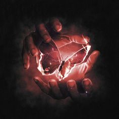 two hands are holding a glowing object in the middle of their palm, with lightning coming out of it