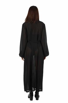 Effortlessly stylish and super versatile, our sheer black robe goes with everything in your closet. Layer it over bodysuits to keep the sun off your skin and layer it under accessories like a harness or shoulder holster bags for a unique look. FEATURES: Maxi length Made with medium weight deadstock sheer black chiffon Translucent, not completely transparent Long princess sleeves with button cuffs Removable belt Ethically handmade and 100% carbon neutral FIT NOTES:This sheer black robe is designe Sheer Long Sleeve Festival Cover-up, Sheer Long Sleeve Party Cover-up, Black Sheer Cover-up For Spring, Sheer Black Cover-up For Spring, Black Wrap Cover-up For Spring, Chic Fitted Festival Cover-up, Chic Open Front Cover-up For Festivals, Festival Open Front Cover-up, Fitted Sheer Chic Cover-up