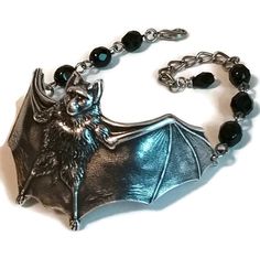 This cute bat bracelet was created using jet black Czech glass beads and antiqued silver plated brass!  They are a classic old school gothic style lovingly hand made by a genuine old school goth! ~ Jet black glass beads  ~ Metal components are antiqued silver brass ~ Bracelet measures 7-9 inches around with an extender chain VEXED JEWELRY: ONE-OF-A-KIND HANDCRAFTED PIECES MADE WITH LOVE, CARE, EXPERTISE & TOP QUALITY MATERIALS Gothic Silver Bracelets For Halloween, Silver Gothic Bracelets For Halloween, Novelty Silver Bracelet For Halloween, Silver Halloween Novelty Bracelet, Novelty Silver Halloween Bracelet, Gothic Adjustable Bracelets For Halloween, Adjustable Black Bracelet For Collectible, Adjustable Black Bracelet For Collectors, Adjustable Gothic Gunmetal Jewelry