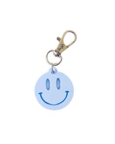 a blue smiley face keychain on a white background