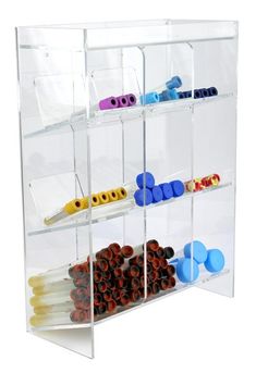 a clear plastic storage rack with several different items in the bins on each shelf