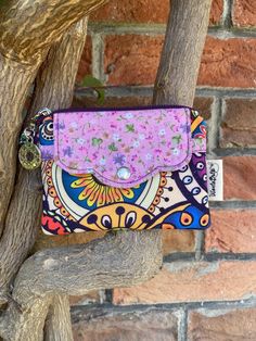 Make life's little moments unforgettable! This handmade wallet, adorned with vibrant mandala patterns and bold colors, is not just an accessory - it's a piece of art that brings joy every time you use it. Carefully crafted to be both stylish and practical, it's perfect for everyday use. And the best part? You can make it truly yours with personalized details! Personalization: Make It Uniquely Yours Add your name, a special date, or a short message to give this wallet a personal touch. It's perfect for creating a keepsake that's truly one-of-a-kind. Real Leather Tag: Your personalization is pressed into genuine leather, available in natural, camel, or dark colors. For camel and dark leather options, we offer a luxurious gold foil imprint for an extra touch of elegance! More Than Just Text: Bohemian Multicolor Coin Purse For Daily Use, Multicolor Coin Purse With Cell Phone Pocket, Bohemian Multicolor Wallets For Daily Use, Multicolor Wallets With Cell Phone Pocket For Gift, Multicolor Wallet With Cell Phone Pocket For Gift, Pink Coin Purse With Cell Phone Pocket For Gift, Bohemian Multicolor Wallets As Gifts, Bohemian Wallets With Card Slots For Everyday Use, Handmade Pink Wallets For Everyday Use