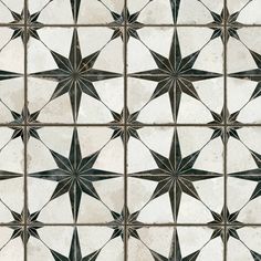 a white and brown tile with stars on it