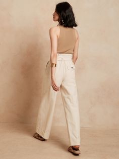 Lustrous and softly structured, this high rise pant is expertly crafted from lightweight faille fabric, cut in an exaggerated wide leg silhouette anchored by a wide, cuffed hem for commanding style.  WIDE-LEG FIT: High waisted.  Straight from waist t Chic Wide Leg Cotton Pants For Work, Elegant High-waisted Cotton Culottes, Chic Cotton Wide Leg Pants, Chic Cotton Culottes For Work, Chic Cotton Straight Culottes, Chic Wide Leg Cotton Culottes, Chic High-waist Cotton Culottes, Chic High Waist Cotton Culottes, Paperbag Pants