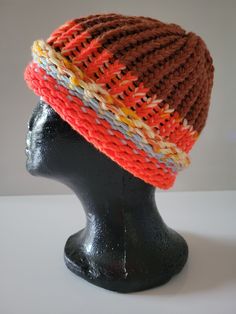 a knitted hat on top of a mannequin head