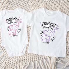 This cute graphic outfit is great for the new mom to be or just cute everyday wear for your child. These can be customized in your choice of vinyl color as shown, the black and white vinyl colors are standard. Garments come in three colors Onesies® & T-Shirts come in a variety of sizes of your choice. We use high quality, soft flex vinyl which not only creates a sharp, vivid graphic but will never look "faded" or “washed out” like some inks commonly do. Processing time is 2-4 days, delivery will Playful Graphic Print T-shirt For Family, White Fun T-shirt For Mother's Day, Matching Graphic Print T-shirt For Gender Reveal, Playful White T-shirt For Mother's Day, Playful Name Print T-shirt For Mother's Day, Cute White T-shirt For Mother's Day, Fun White T-shirt With Heat Transfer Vinyl, White Fun T-shirt With Heat Transfer Vinyl, Graphic Outfit