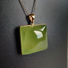 ITEM DESCRIPTION: >>The pendant is made from Solid 14K Yellow Gold. Gemstone used is absolutely natural and ethically sourced. >>Natural Prehnite in Cabochon Square shape with bezel setting is studded on it with utmost precision. >>This is a minimalist design and is absolutely hassle-free and everyday jewelry. Gem: Prehnite Gem size: 23.5x23.5 mm Square Gem weight: 68.8 carats Gold purity: 14K (58.33% approx.) Gold weight: 1.13 grams Gross weight: 14.89 grams The Gold purity is guaranteed and it Elegant Green Gemstones In 14k Gold, Formal Green Cabochon Necklace, Formal Green Polished Gemstones, Green Pendant Gemstones For Formal Occasions, Fine Jewelry Chrysoprase For Formal Occasions, Formal Fine Jewelry With Chrysoprase, Formal Chrysoprase Fine Jewelry, Rectangular Green Gemstone Jewelry, Rectangular Green Jewelry With Natural Stones