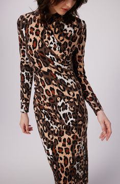 A wrapped bodice adds a grace note to a knit dress patterned in a fierce print. Hidden back-zip closure Surplice V-neck Long sleeves 87% viscose, 10% nylon, 3% spandex Dry clean Imported Leopard Print Bodycon Dress For Fall, Fitted Leopard Print V-neck Midi Dress, Fitted Leopard Print Long Sleeve Midi Dress, Fitted Leopard Print Midi Dress With Long Sleeves, Fitted Long Sleeve Leopard Print Midi Dress, Knit Dress Pattern, Wrap Front Dress, Jungle Cat, Nordstrom Dresses