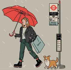 a woman walking her dog with an umbrella