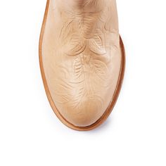 Embellished with an intricate floral pattern, this luxurious leather boot features a classic round toe and a sturdy stacked block heel for a twist on traditional style. Details & Fit Fit is True to size Color: Beige stamp Floral Detail: Round toe, Slip on. Heel measures approximately 2 inches Shaft 15 inches Calf circumference Top "17- Mid "15.5 4mm Padded Insole Leather upper and leather lining, Manmade sole Available in half sizes, available in sizes 5.5-11 imported Flat Heel Boots, Flat Wedges, Leather Boot, Kids Boots, Platform Boots, Platform Heels, Sales Gifts, Wedge Heels, Traditional Style