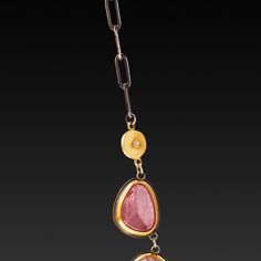 Revel in the lovely shades of pink sapphire wrapped in warm 22k gold! Eleven rose cut sapphires slices are linked together, and accented with a lovely hammered 22k gold fringe creating delicate movement. The necklace is finished with two hammered 22k gold disks with a twinkling diamond at the center, connected to an oxidized sterling silver chain. The center pendant, including 22k gold fringe, measures approximately 24mm in length. Sapphire settings are backed in sterling silver. Matte finish. Gold Jewelry With Rose Cut Diamonds And Pink Sapphire, Pink Sapphire Necklace, Gold Fringe, Sapphire Necklace, Shades Of Pink, Gold Wire, Oxidized Sterling Silver, 22k Gold, Pink Sapphire