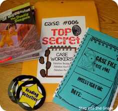 three books and a badge sitting on top of a table