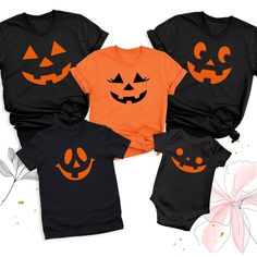 Pumpkin Face Halloween Shirt, Family Matching Halloween Tshirt, Halloween Party Group Shirts, Spooky Pumpkin Outfits, Family Pumpkin Tees The Pumpkin Face Halloween Shirt is the perfect way to bring spooky fun to your Halloween celebrations! Our Family Matching Halloween Tshirt is ideal for creating memorable moments with loved ones. Whether you're attending a Halloween party or just want to get into the festive spirit, our Halloween Party Group Shirts ensure everyone looks coordinated and styli Family Matching Black Tops For Halloween, Black Short Sleeve Top For Halloween, Family Matching Black Tops For Fall, Black Family Matching Tops For Fall, Orange Crew Neck Top For Halloween, Family Matching Halloween Tops Short Sleeve, Spooky Character Print Tops For Costume Party, Family Matching Black Tops With Character Print, Black Family Matching Tops With Character Print