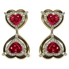 These Double Heart Shape Ruby Earrings with Diamonds in 18K Yellow Gold, part of the 'G-One' Collection, are a stunning display of elegance. These earrings showcase two heart-shaped rubies adorned with diamonds, set in 18K yellow gold. The design is both sophisticated and romantic, making it an ideal choice for adding a touch of glamour to any look. * Gemstone size: 7 x 6 mm * Gemstone: 100% Earth Mined * Approx. gemstone Weight: 4.74 Carats * 100% Natural Earth-Mined Diamonds * Carat: Approx.: 0.72 * Color: G/H * Clarity: VS * Cut: Heart * Metal: 18K Yellow Gold Diamond Earring Design, Sparkling Jewelry, Diamonds Earrings, Ruby Heart, Double Diamond, Sparkle Jewelry, Ruby Earrings, Double Heart, Two Hearts