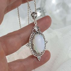 925 Sterling Silver Filigree Art Moonstone Gemstone Oval Pendant Necklace Silver Chain is 18.00" + 2.00" extender. Pendant height: 1.90 Inches; Pendant width: 1.05 Inches Natural Moonstone gemstone is 13 X 18 mm oval cabochon cut. Filigree is made of delicate metal strands that have been skillfully fashioned to create an outstanding combination of old and modern art. Originating in Mesopotamia, Anatolia. It is made of delicate metal strands that have been skillfully fashioned to create an outsta Filigree Pendant Necklace, Oval Pendant Necklace, Filigree Jewelry, Chain For Women, Filigree Pendant, Aqua Chalcedony, Art Pendant, Sterling Silver Filigree, Sterling Silver Necklace Pendants