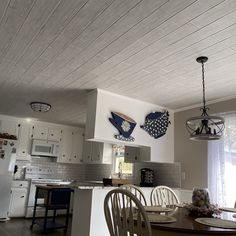 the kitchen and dining room are clean and ready for us to use in their new home