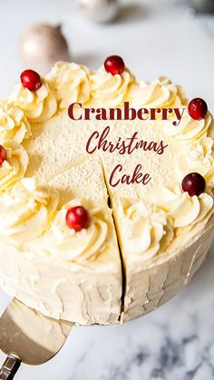 a cake with cranberry frosting and christmas decorations