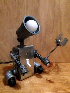 Robot Lamp (with metal flower) Robot Bedside Lamp, Industrial Pipe Lamp, Robot Lamp, Lamp Inspiration, Industrial Robots, Industrial Style Lighting, Steampunk Lamp, Pipe Lamp, Gadgets Technology Awesome