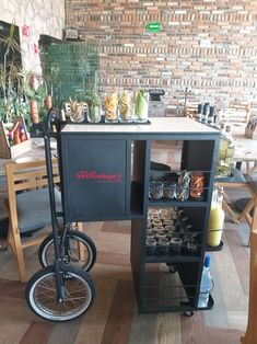 a black bike is parked next to a table