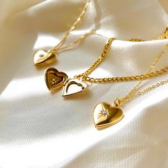 - Gold North Star Heart Locket Necklace - Today is your day to shine with MayaMore! This item is nickel-free and lead-free. This item is made of high-quality materials. This item is hypoallergenic so it won't irritate sensitive skin. P R O D U C T D E T A I L S Material: Pendant: Gold Plated, Cubic Zirconia Chain Material Lip Chain: Gold Plated over Stainless Steel Twist Chain: Gold Filled Dainty Chain: Gold Filled Figaro Chain: Gold Filled Box Chain: Gold Plated (Non-waterproof) Link Chain: Gol Heart Cut Locket Necklace As A Gift, Gold Heart-cut Locket Necklace For Gift, Heart Cut Locket Necklace With Heart Charm As Gift, Heart Cut Heart Charm Jewelry For Birthday Gift, Heart Cut Locket Necklace For Valentine's Day, Double Heart Locket Necklace For Mother's Day, Valentine's Day Heart Cut Locket Necklace, Valentine's Day Heart Charm Locket Necklace For Anniversary, Mother's Day Gift Double Heart Locket Necklace