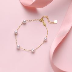 Delicately crafted, this 18K Gold Chinese Akoya Pearl Tin Cup Bracelet is a symbol of refined elegance. Featuring 7-8mm Akoya pearls, rated AAAA for quality, these pearls are elegantly spaced along an 18K gold chain, embodying the chic Tin Cup style. The bracelet measures 16.5cm in length with an additional 5cm extension, ensuring a perfect fit. This piece is ideal for those seeking to add a touch of sophistication to their attire with the timeless beauty of Akoya pearls and the luxury of gold. Yellow Gold Plated Bracelets With Pearl Chain, Luxury Pearl Bracelets For Anniversary, Fine Jewelry Pearl Bracelets For Wedding, Formal Fine Jewelry Pearl Bracelet, Akoya Pearl Charm Bracelet With Round Beads, Luxury Akoya Pearl Bracelet In Yellow Gold, Luxury Akoya Pearl Yellow Gold Bracelet, Gold Akoya Pearl Bracelet With Pearl Pendant, Luxury Akoya Pearl Bracelets For Wedding