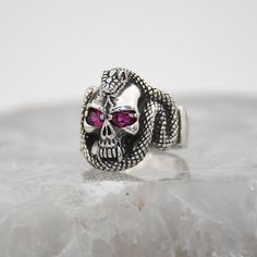 Snake Silver Ring, Skull Design, 925 Sterling Silver, Garnet Gemstone Ring,Special Design Biker Ring,Unisex Vintage Silver,Biker Style Ring  ✦ Details ✦ * Material: 925 Sterling Silver * Gemstone: Garnet * Weight: 14,50 grams * Sides oxidized * Stamp: 925 * Available sizes; 5 US to 16 US. Contact me if you need any other size! ✦ Shipping ✦ * Processing time: 1-3 business days. * This item ships from my Turkish workshop in Istanbul. * Add your phone number in address box for a smoother delivery. Sterling Silver Skull Ring Hallmarked, Sterling Silver Skull Ring Stamped 925, Silver Skull Ring With Gemstone, Sterling Silver Skull Ring With Gemstone, Biker Ring, Biker Rings, Luxury Gift Box, Biker Style, Skull Design