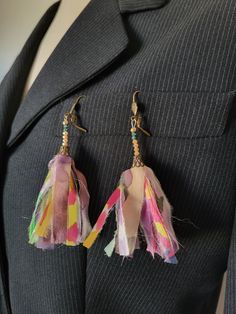 These earrings are made with fine colored silk ribbons fixed in a small chiseled bell, like pompoms. I added pink seed beads * Silk chiffon, painting on silk - pink and blue pearl, small chiseled bell, bronze-colored metal sleepers (nickel and lead free) * loop length 9cm   length approximately 7 cm / width approximately 5 cm * Made in Lyon * pastel, pink, green, bronze * Style: Bohemian and hippie * Sleeper Packaging : Ready to give - carefully packaged in a small white organza bag and natural Elegant Pink Tassel Earrings For Spring, Handmade Pink Tassel Earrings For Festival, Pink Tassel Earrings As Gift, Pink Handmade Tassel Earrings For Festivals, Pink Bohemian Earrings For Celebration, Spring Handmade Adjustable Tassel Earrings, Artsy Pink Earrings For Party, Artsy Pink Earrings For Festivals, Silk Earrings