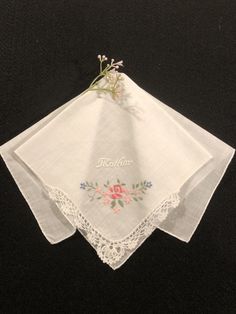 So lovely, pink and blue hand embroidered flowers with "Mother" in white. White cotton hankie with a hand crocheted corner and hand rolled hem. 12 inches square. Excellent condition. Circa 1950. Vintage Embroidered Summer Handkerchiefs, Floral Embroidered Handkerchiefs For Spring Wedding, Spring Wedding Handkerchiefs With Floral Embroidery, White Wedding Handkerchiefs For Summer, Spring Handkerchiefs With Floral Embroidery As Gift, Floral Embroidered Handkerchiefs For Spring Gift, White Embroidered Flower-shaped Handkerchiefs, Spring Floral Embroidery Handkerchiefs As Gift, White Embroidered Flower Shaped Handkerchiefs