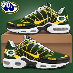 the green bay packers nike air max sneakers are on display in front of a cardboard box