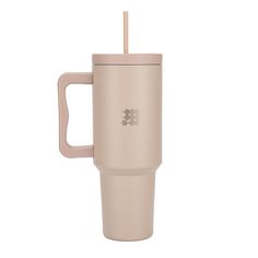 the tumbler cup has a straw in it and is light pink with a brown lid