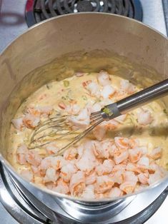 shrimp being cooked in a pot on the stove