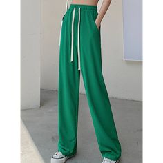 This summer season wears something stylish like this Women's Ice Silk High Waist Casual Summer Pants. These pants are perfect for the modern woman who wants to stay cool while looking great. The straight pant style and solid pattern keep it simple and versatile, while the high waist provides both comfort and coverage. The drawstring closure allows you to adjust the fit to your liking, and the loose fit makes them perfect for those hot summer days. Specification: Pant Style: STRAIGHT Front Style: Trendy Green Non-stretch Wide Leg Pants, Trendy Summer Leisure Pants, Baggy Green Sweatpants For Summer, Leisure Wide Leg Trousers, Summer Baggy Green Sweatpants, Solid Wide Leg Pants For Leisure, Trendy Summer Leisure Sweatpants, Trendy Summer Sweatpants For Leisure, Trendy Ankle-length Sweatpants