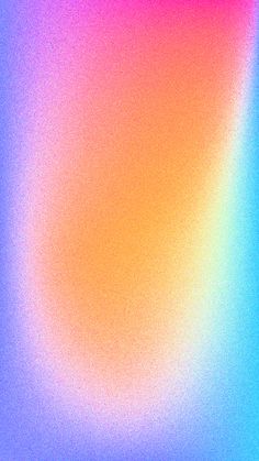 a blurry image of an orange, pink and blue background with the color red