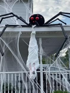 Body Halloween Decor, Spider On Roof Halloween, Spider Victim Halloween, Diy Body Wrapped In Spider Web, Diy Halloween Hanging Corpse, Outside House Halloween Decor, Scary Spider Halloween Decorations, Outside Halloween Spider Decorations, Diy Spiders Outdoor