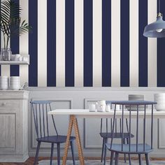 a dining room with blue and white striped walls