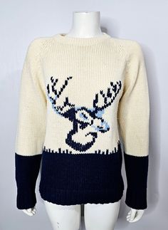 "Vintage 1970s novelty print sweater. Knit sweater with a Deer on the front in various shades of blue. The background is a cream colour, while the bottom half of the sweater and sleeves are navy blue. Brand label is Scrambler by Triton. Made in Hong Kong. 100% acrylic. Marked a Size Medium , but please double check measurements below as there are no refunds or exchanges. Great vintage condition - no rips, holes, or stains. Measurements (unstretched): Bust, 38\" + Waist, 36\" + Length, 25\" --- L Deer Sweater, Pull Vintage, Chunky Knit Sweater, Cream Colour, Brand Label, Print Sweater, Pullover Sweater Women, Chunky Knits Sweater, Novelty Print