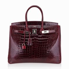 Hermes Birkin 35 bag featured in rich Bordeaux Porosus Crocodile.An exquisite Hermes crocodile handbag in jewel toned deep bordeaux.Crisp with palladium hardware.This exquisite crocodile skin bag is a magnificent addition to any Hermes handbag collection.Comes with lock, keys, clochette, sleepers, raincoat and signature Hermes box.For 22 years Mightychic has offered superb customer service that meets exquisite Hermes selections at your fingertips. final sale BAG MEASURES:LENGTH 35 cm / 14"TALL 2 Hermes Crocodile, Brunette Aesthetic, Crocodile Handbags, Hermes Birkin 35, Handbag Collection, Crocodile Bags, Hermes Box, Fancy Bags, Crocodile Skin